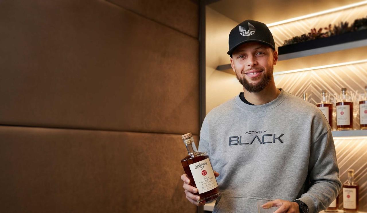 Stephen Curry signing Gentleman’s Cut Bourbon bottles